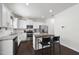 Modern kitchen with white cabinets, stainless appliances, and granite island with seating at 115 Zulabelle Ct, Garner, NC 27529