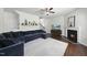 Cozy living room with a fireplace, plush sectional sofa, and stylish decor at 115 Zulabelle Ct, Garner, NC 27529