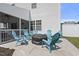 Back patio area with outdoor seating and space for entertaining at 115 Zulabelle Ct, Garner, NC 27529