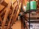 Unfinished attic offers exposed rafters, storage shelves, and room for organization at 117 Whitehaven Ln, Cary, NC 27519