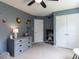 Serene bedroom showcasing a dresser, closet, and cute space decor at 117 Whitehaven Ln, Cary, NC 27519