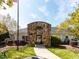 Community clubhouse featuring stone facade, arched entryway and well-maintained landscaping at 117 Whitehaven Ln, Cary, NC 27519