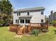 Exterior back elevation of home showing a large deck perfect for entertaining at 117 Whitehaven Ln, Cary, NC 27519