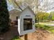 Charming community 'take a book, share a book' library outside of a home in a residential area at 117 Whitehaven Ln, Cary, NC 27519
