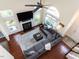 Aerial view of stylish living room with fireplace, windows, and plush gray sectional sofa at 117 Whitehaven Ln, Cary, NC 27519