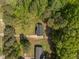 Aerial view of a house with a nice, wooded lot at 120 King Charles Rd, Hillsborough, NC 27278