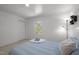 Inviting bedroom with soft blue bedding, closet, and a window offering natural light at 120 King Charles Rd, Hillsborough, NC 27278