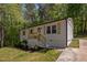 Charming home featuring fresh white siding, light wood accents, and a cozy front porch at 120 King Charles Rd, Hillsborough, NC 27278