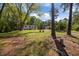 Exterior of home with large trees, landscaping, and a driveway at 120 King Charles Rd, Hillsborough, NC 27278