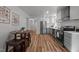 Bright kitchen with stainless-steel appliances, white cabinets and a view to the dining area at 120 King Charles Rd, Hillsborough, NC 27278