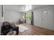 Bright and airy living room with wood floors and a view to the front lawn at 120 King Charles Rd, Hillsborough, NC 27278