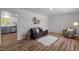 Spacious living area with wood floors, modern décor, and lots of natural light at 120 King Charles Rd, Hillsborough, NC 27278