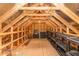 Spacious attic with wood beams and open rafters, offering ample storage and a unique architectural feel at 1206 Areca Way, Durham, NC 27703