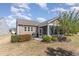 Well-maintained backyard with a screened-in porch, grill, patio, and manicured landscaping at 1206 Areca Way, Durham, NC 27703