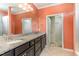Spacious bathroom with double vanity, granite countertops, and a walk-in closet at 1206 Areca Way, Durham, NC 27703
