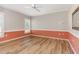 Bright bedroom with two-toned walls, hardwood flooring, natural light, and a ceiling fan at 1206 Areca Way, Durham, NC 27703