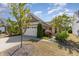 Charming single-story home featuring a manicured lawn and an attached two-car garage at 1206 Areca Way, Durham, NC 27703