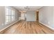 Spacious living room with hardwood floors and natural light streaming through plantation shutters at 1206 Areca Way, Durham, NC 27703