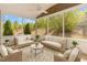 Cozy screened-in porch with comfortable seating and scenic backyard views at 1206 Areca Way, Durham, NC 27703