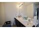 The primary bathroom has a double sink, vanity and large mirror, with lots of storage and natural light at 123 Charndon Way, Fuquay Varina, NC 27526