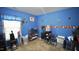 A small bedroom with blue walls, baseball-themed decor, and carpeted flooring at 123 Charndon Way, Fuquay Varina, NC 27526