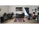 The bedroom features a desk area, dresser, carpet flooring, and a large window for natural light at 123 Charndon Way, Fuquay Varina, NC 27526