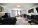 This is a large bedroom with a black bed set, tv, desk and sports memorabilia at 123 Charndon Way, Fuquay Varina, NC 27526