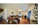Large living room featuring hardwood floors, ample natural light, and cozy furnishings, perfect for relaxation at 123 Charndon Way, Fuquay Varina, NC 27526