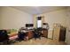 Functional office space with a traditional desk, file cabinets, and natural lighting for a productive atmosphere at 123 Charndon Way, Fuquay Varina, NC 27526