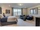 Spacious bedroom featuring a cozy seating area and large window providing natural light at 125 Verona Villa Dr, Burlington, NC 27215