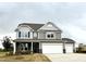 Charming two-story home with a three car garage and beautifully landscaped front yard at 125 Verona Villa Dr, Burlington, NC 27215
