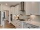 Contemporary kitchen with white cabinets, quartz counters, and a sleek range hood at 125 Verona Villa Dr, Burlington, NC 27215