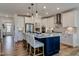 Bright kitchen with stainless steel appliances, a large island, and modern pendant lighting at 125 Verona Villa Dr, Burlington, NC 27215