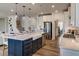 Modern kitchen featuring stainless steel appliances, a center island with seating, and stylish fixtures at 125 Verona Villa Dr, Burlington, NC 27215
