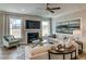 Cozy living room with fireplace, large windows, and comfortable seating at 125 Verona Villa Dr, Burlington, NC 27215