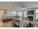 Spacious living area with a fireplace, kitchen island, dining area and comfortable seating at 125 Verona Villa Dr, Burlington, NC 27215