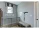 Well-organized mudroom with dog gate, bench, and hooks at 125 Verona Villa Dr, Burlington, NC 27215