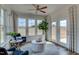 Bright sunroom with multiple windows, comfortable seating, and peaceful views at 125 Verona Villa Dr, Burlington, NC 27215