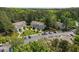 Aerial view of a condominium complex with lush trees, landscaping, and ample parking spaces at 128 Schultz St, Chapel Hill, NC 27514