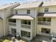 Backyard view of townhomes with balconies, patios, and air conditioning units at 128 Schultz St, Chapel Hill, NC 27514