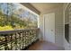 Private covered balcony with outdoor storage overlooking a natural wooded area at 128 Schultz St, Chapel Hill, NC 27514