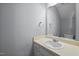 A cozy bathroom featuring a single sink vanity, a mirror, and neutral paint color at 128 Schultz St, Chapel Hill, NC 27514
