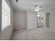 Spacious bedroom features carpet floors, ceiling fan, and ensuite bathroom at 128 Schultz St, Chapel Hill, NC 27514