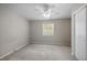 Upstairs bedroom with carpet floors, ceiling fan, closet and natural light at 128 Schultz St, Chapel Hill, NC 27514