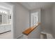 Upstairs hallway with carpet floors with an open view of the bathroom and bedroom at 128 Schultz St, Chapel Hill, NC 27514