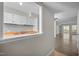 The kitchen features a breakfast bar, white cabinets, butcher block counters, a tile backsplash, and wood-look flooring at 128 Schultz St, Chapel Hill, NC 27514