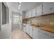 A well-lit kitchen with tile flooring, white appliances, wood countertops, and ample cabinet space at 128 Schultz St, Chapel Hill, NC 27514