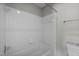 A view of the shower featuring white tiled walls and a standard shower head at 128 Schultz St, Chapel Hill, NC 27514
