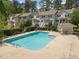 Outdoor swimming pool with nearby condominiums and ample seating areas at 128 Schultz St, Chapel Hill, NC 27514