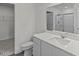 Modern bathroom features a walk-in closet, shower with glass doors, and a vanity with a mirror at 129 N Keatts Winner Ct, Wilson's Mills, NC 27520